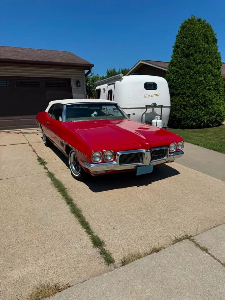 Red 1970 Pontiac LeMans outside after detailing